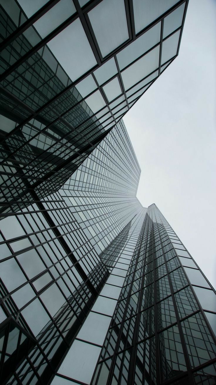 Modern glass high-rise towers reaching into the sky