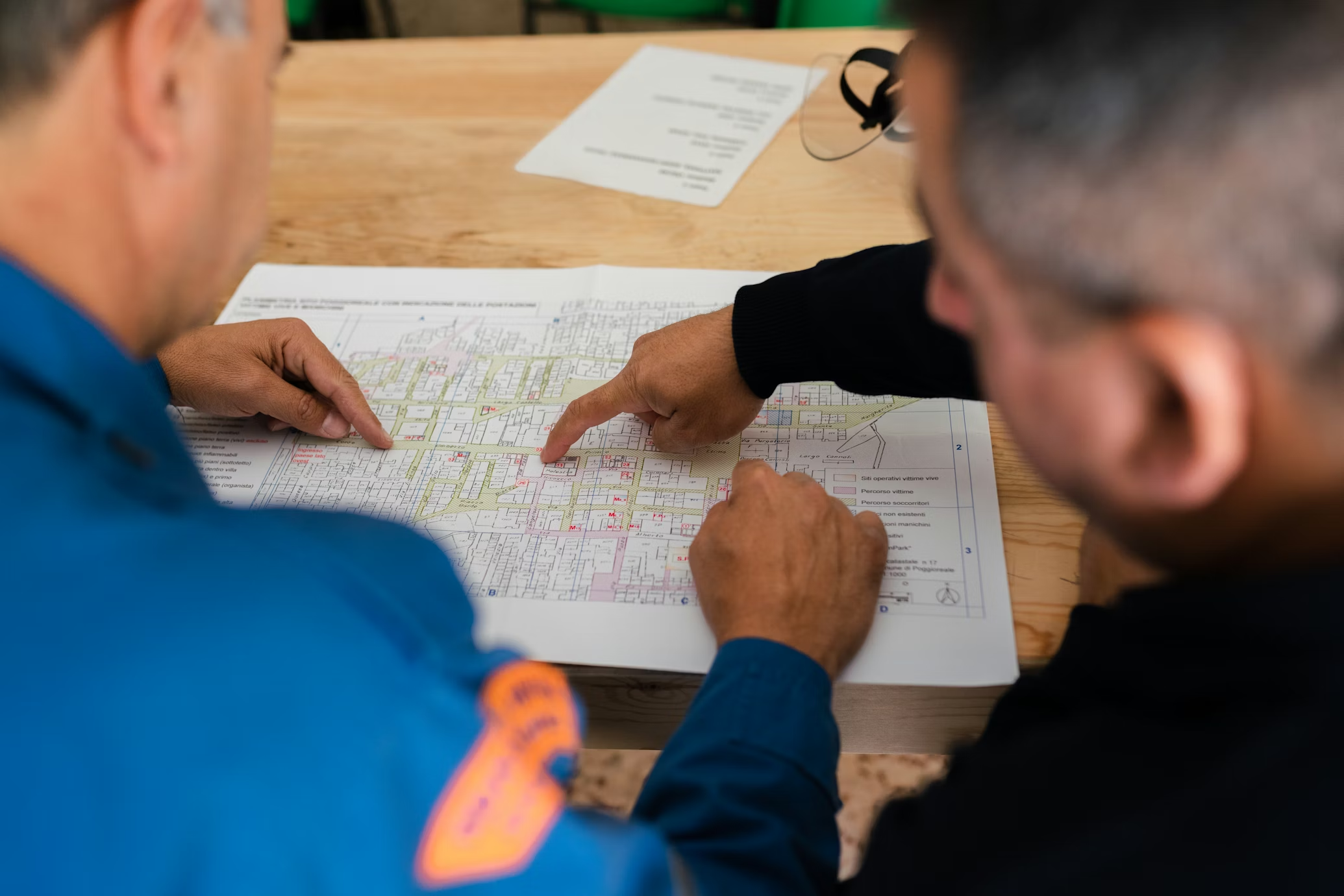 Construction professionals reviewing architectural drawings